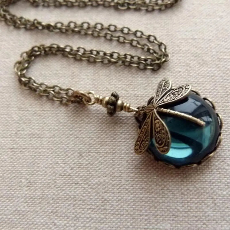 Blue Crystal Dragonfly Necklace In Antique Gold