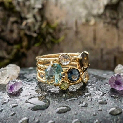 An Elegant Oval & Round Cut Multi Gemstone Ring