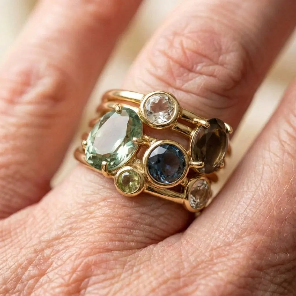 An Elegant Oval & Round Cut Multi Gemstone Ring