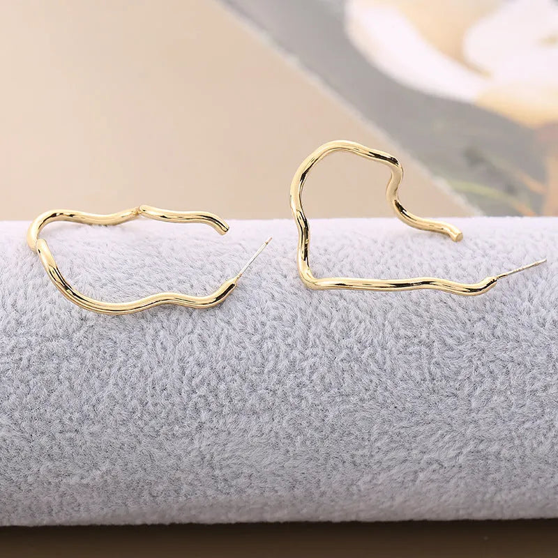 Elegant Wavy Gold Earrings